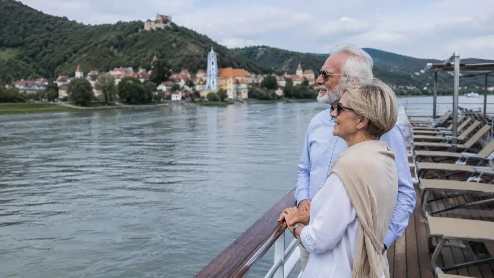 Senior couple enjoying an all-inclusive river cruise for seniors in Europe