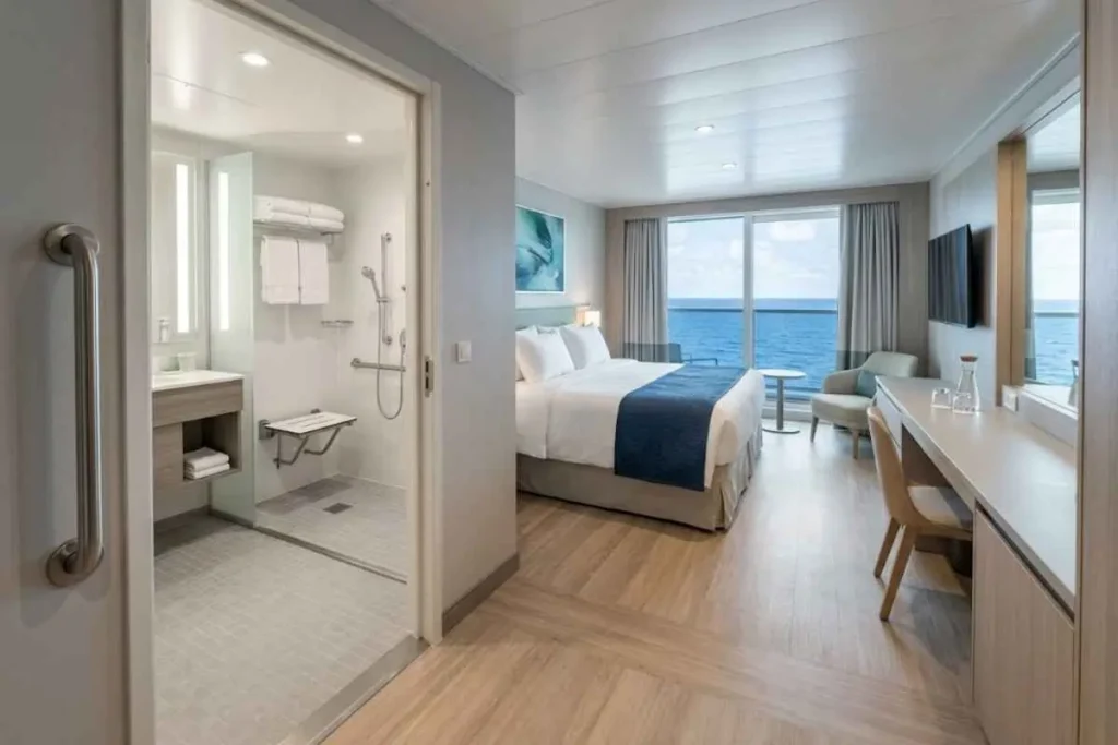 Spacious accessible cruise ship cabin with grab bar, wide
doorway and ocean view window, reserved for seniors who
know the best time to book a cruise is 12 to 18 months out