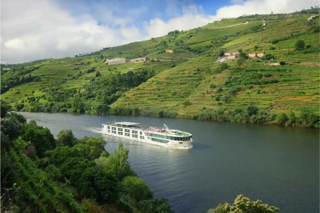 Luxury river cruise ship sailing the Rhine — river lines like Tauck offer zero single supplement cruise deals for solo travelers