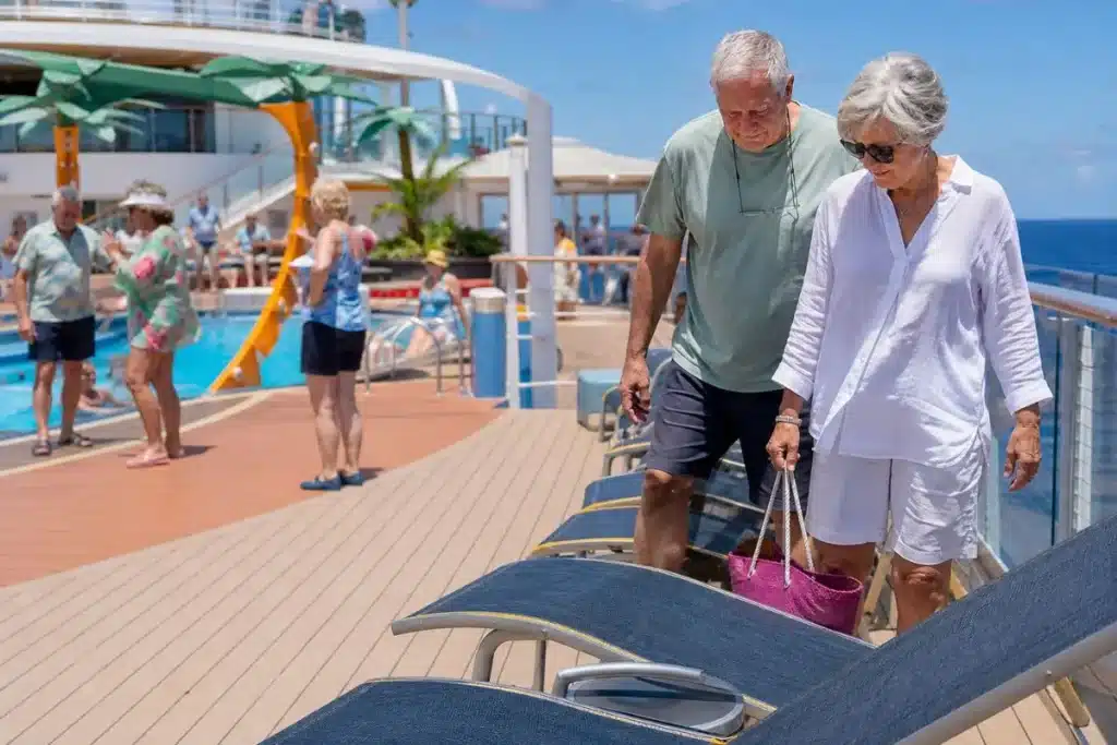 Margaritaville cruise reviews showing seniors choosing quieter seating beside a lively pool deck